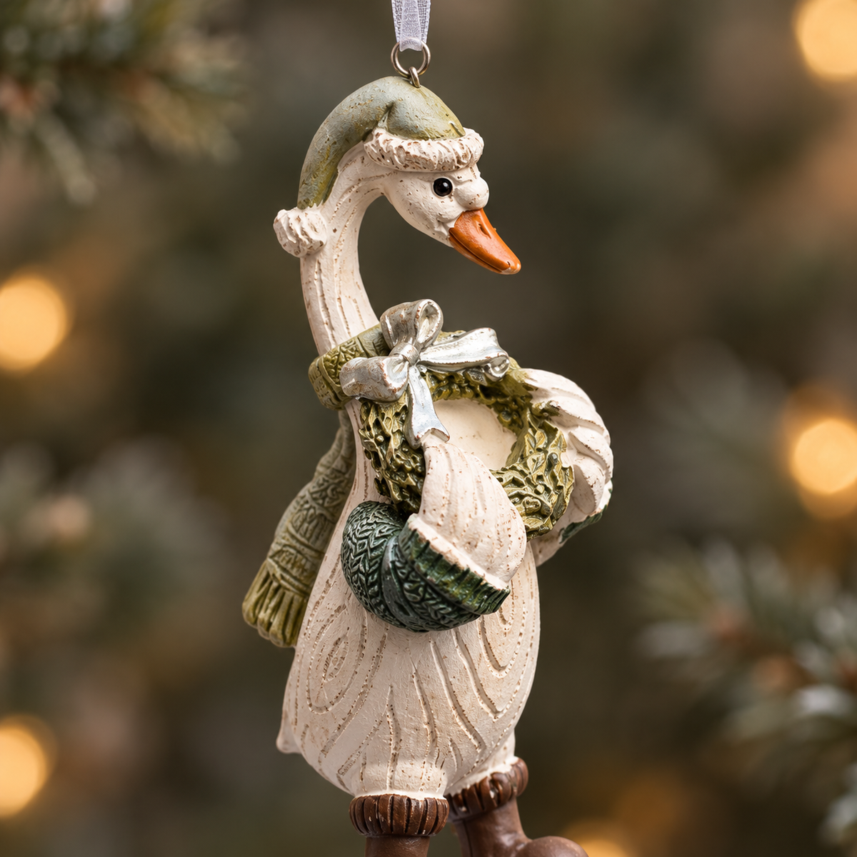 Resin duck Christmas bauble with textured feathers and winter clothing