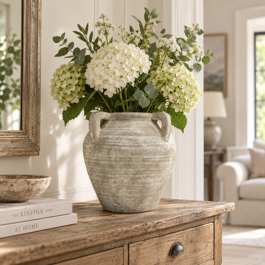Medora stone-effect vase with hydrangeas on a wooden console table