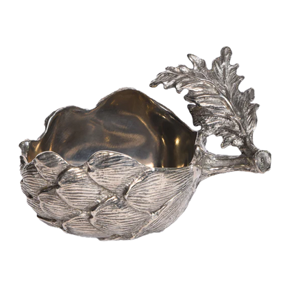 Close-up of the pewter artichoke bowl with its open centre and leaf handle