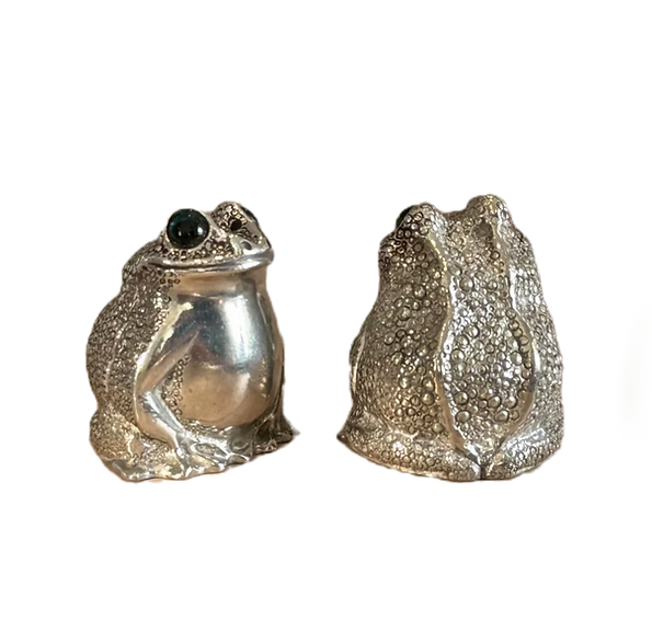 Front and rear views of the pewter frog shaker pair showing rounded bodies and textured detailing
