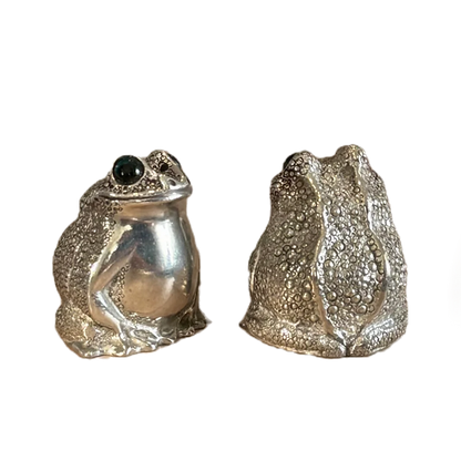 Front and rear views of the pewter frog shaker pair showing rounded bodies and textured detailing