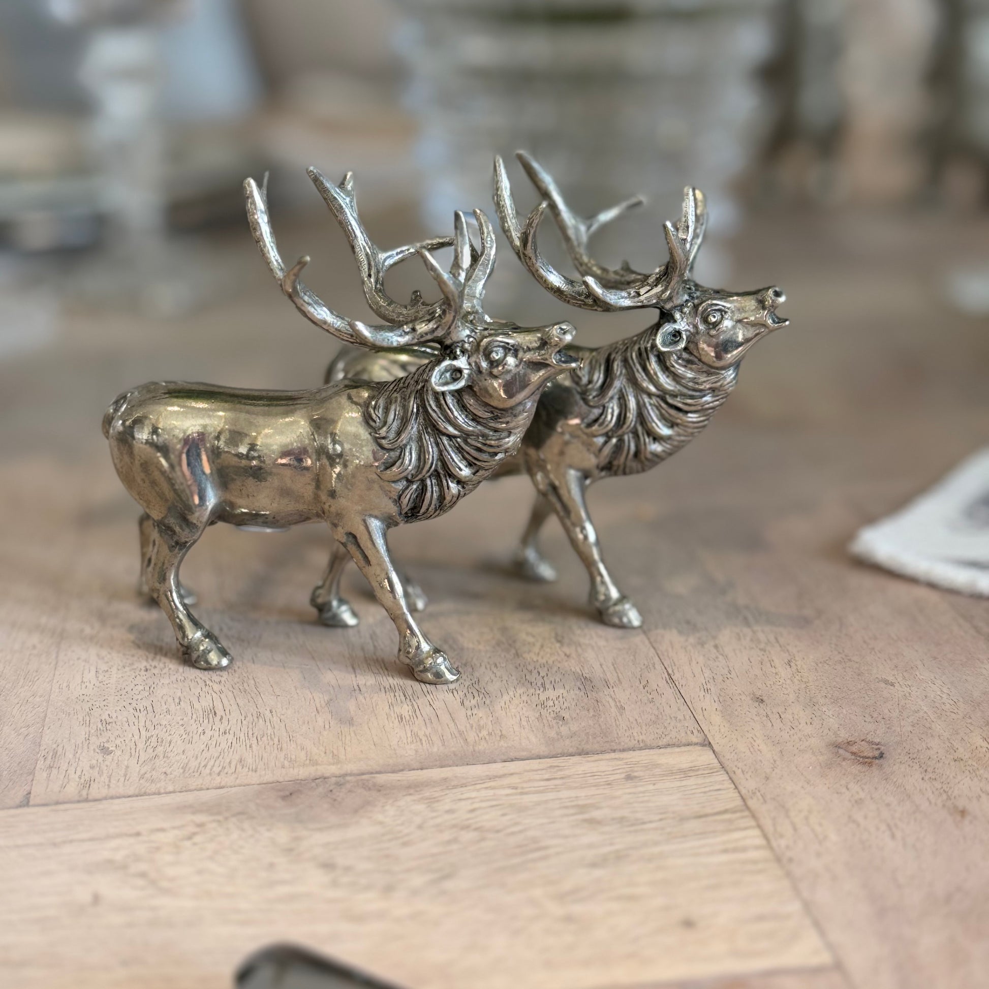 Side view of the roaring stag shaker pair showing polished bodies and detailed necks