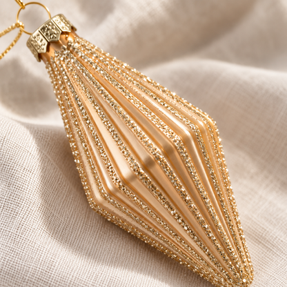 Champagne gold mini finial bauble showing its ribbed finish and glitter detail