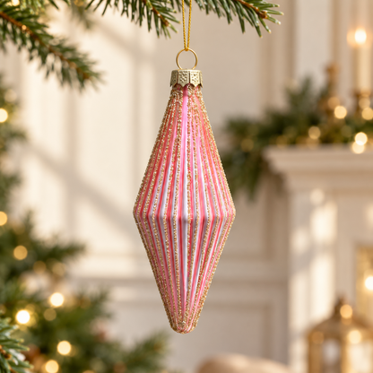 Rose pink 11cm mini finial bauble with gold glittered ribs hanging from a fir branch