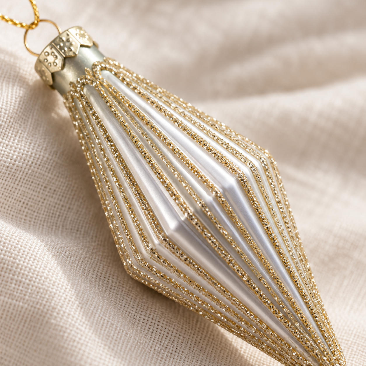 Silver mini finial bauble with sparkling gold glittered ribs and gold-coloured hanging cord