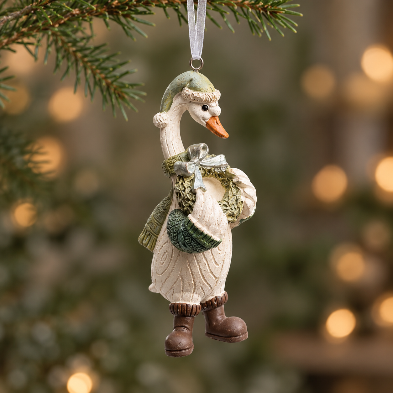 Resin duck Christmas bauble with textured feathers and winter clothing