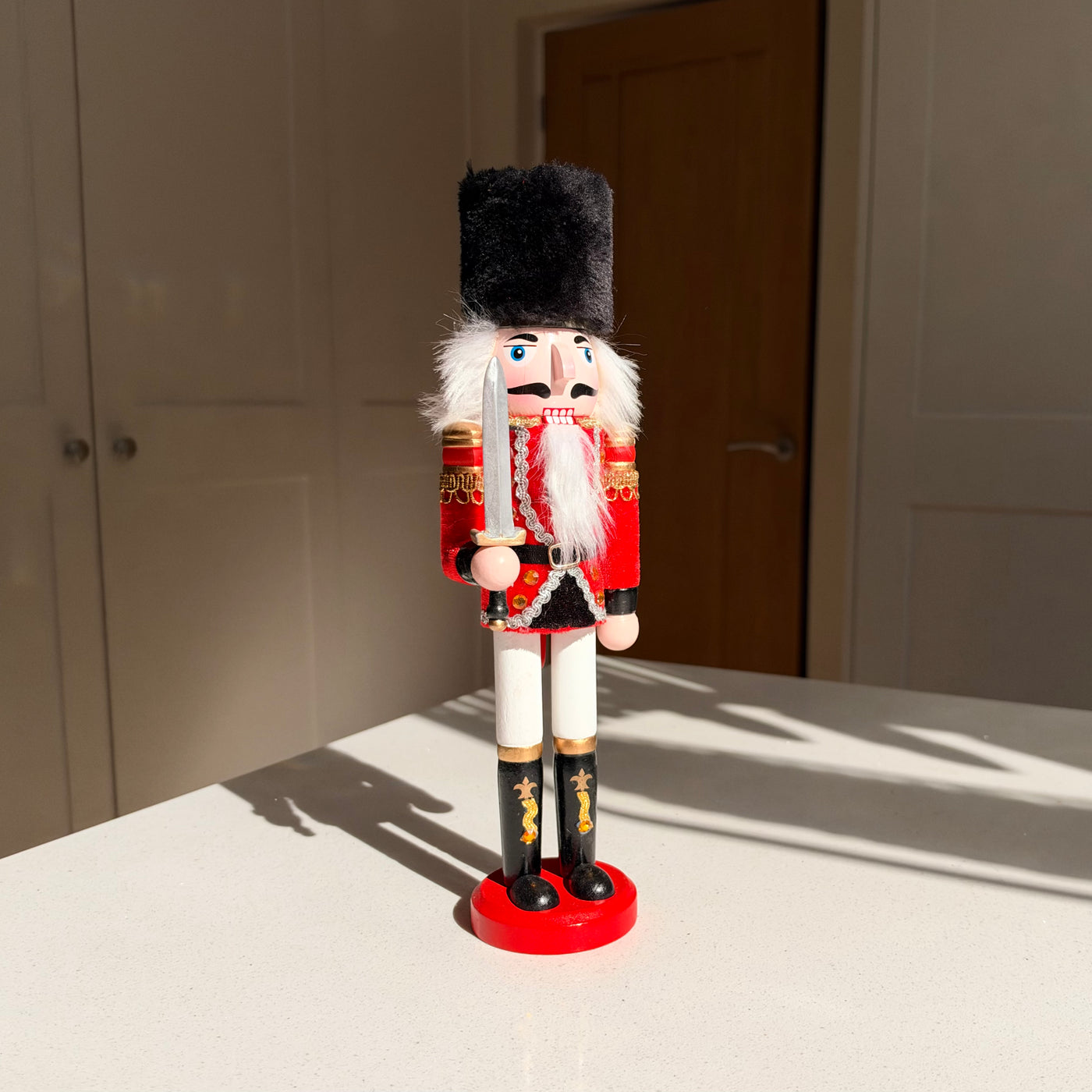 The Scarlet Sentinel – Handmade Wooden Guardsman Nutcracker with Sword, 30cm