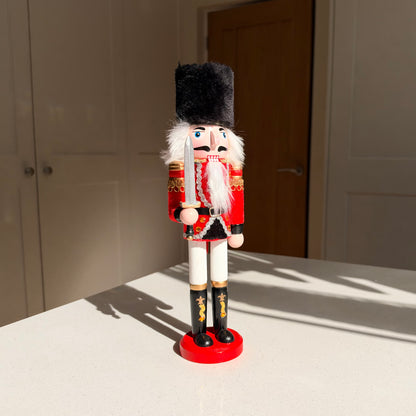The Scarlet Sentinel – Handmade Wooden Guardsman Nutcracker with Sword, 30cm