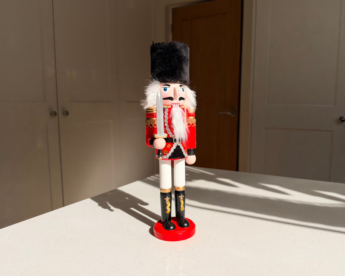 The Scarlet Sentinel – Handmade Wooden Guardsman Nutcracker with Sword, 30cm
