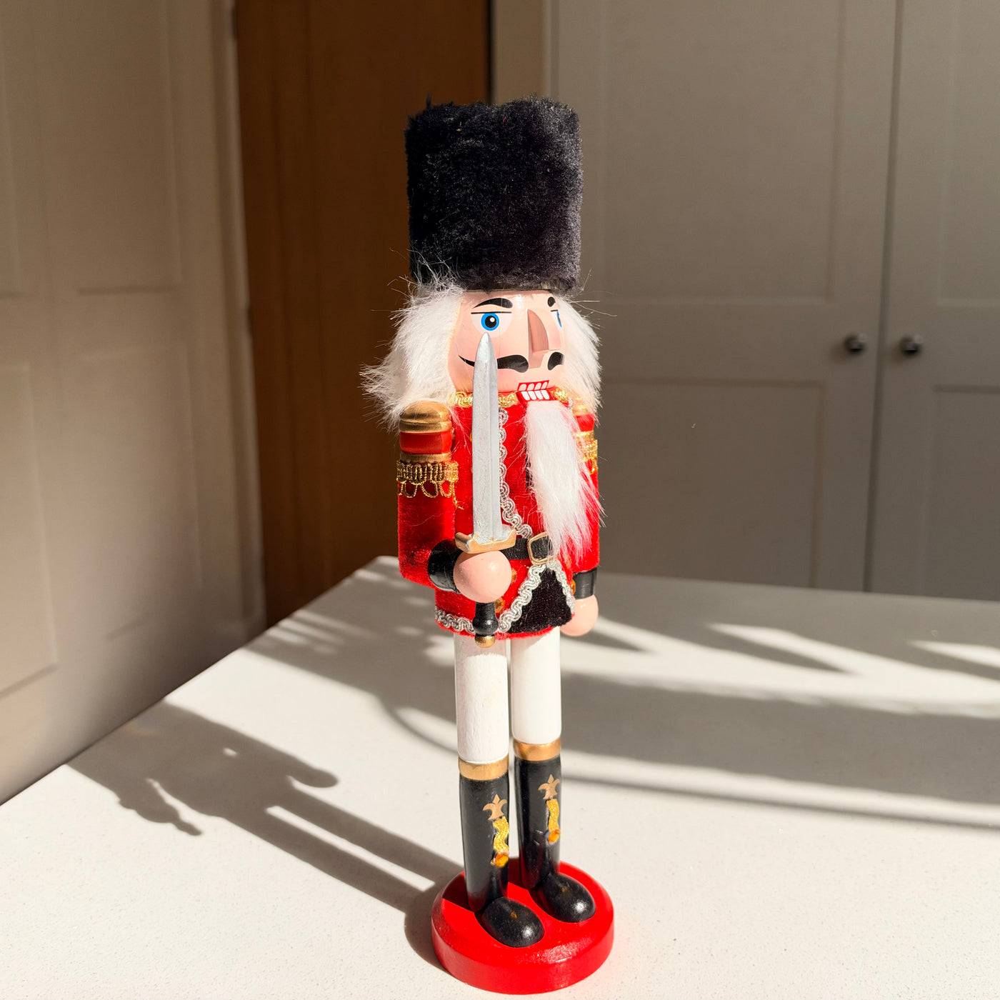 The Scarlet Sentinel – Handmade Wooden Guardsman Nutcracker with Sword, 30cm