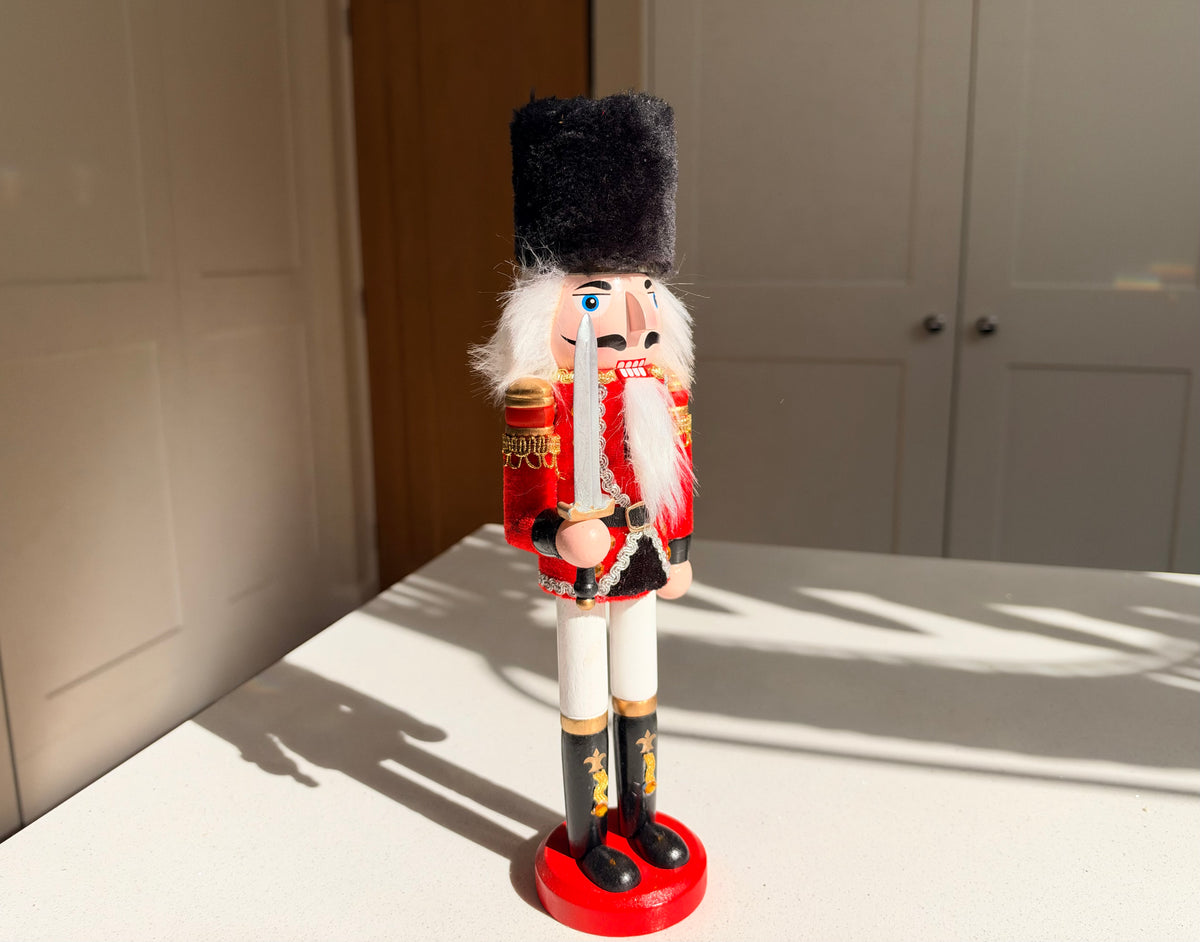 The Scarlet Sentinel – Handmade Wooden Guardsman Nutcracker with Sword, 30cm