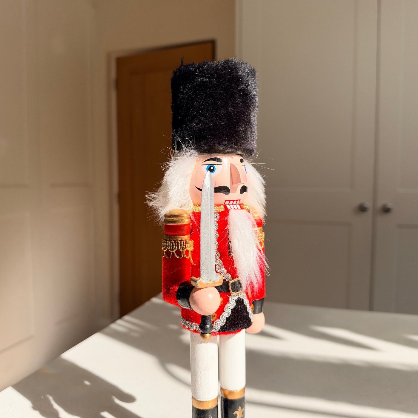 The Scarlet Sentinel – Handmade Wooden Guardsman Nutcracker with Sword, 30cm