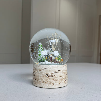 Christmas snow globe with frosted trees and bark-effect base