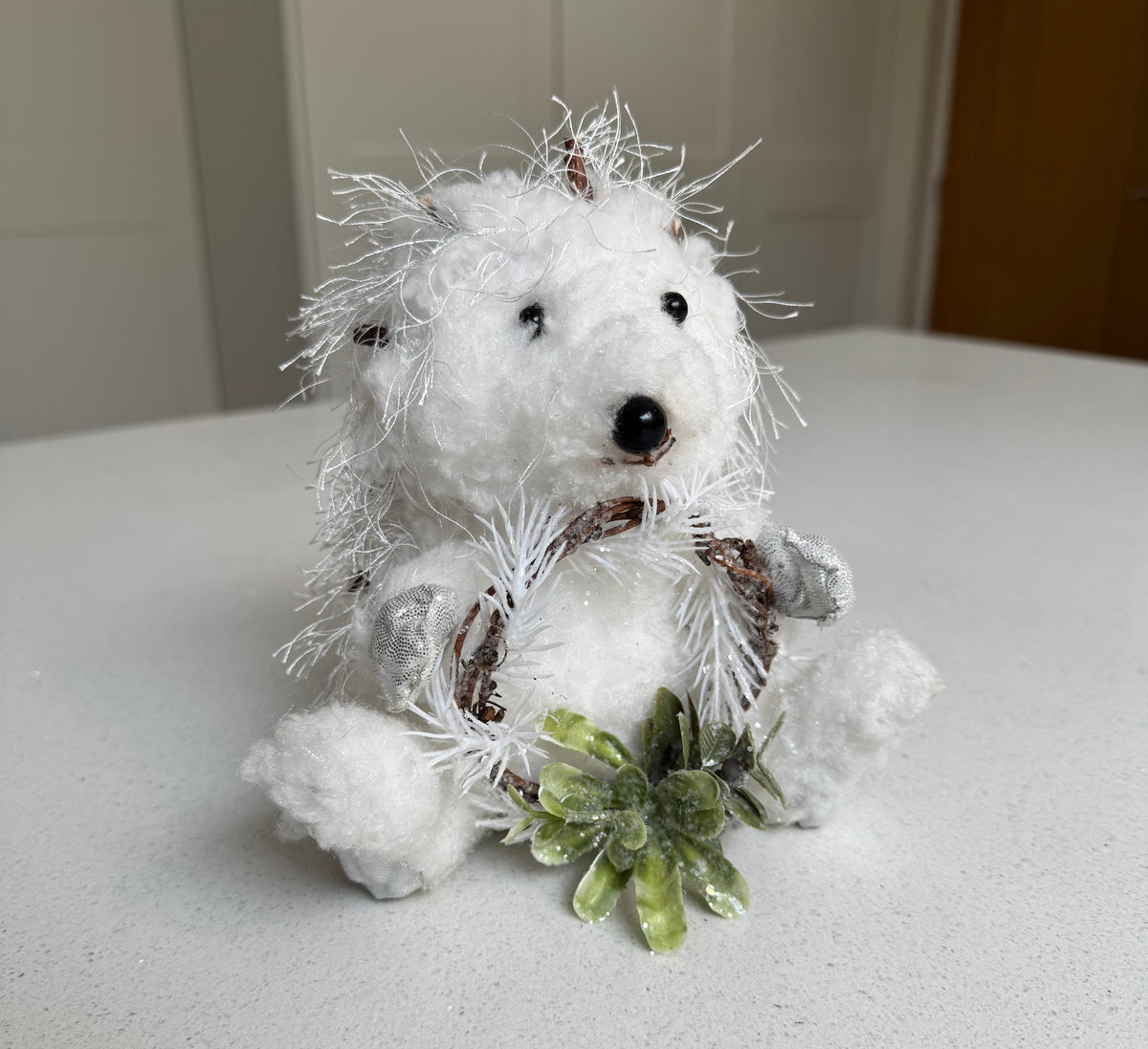 White Festive Hedgehog Ornament Holding a Wreath – 17cm