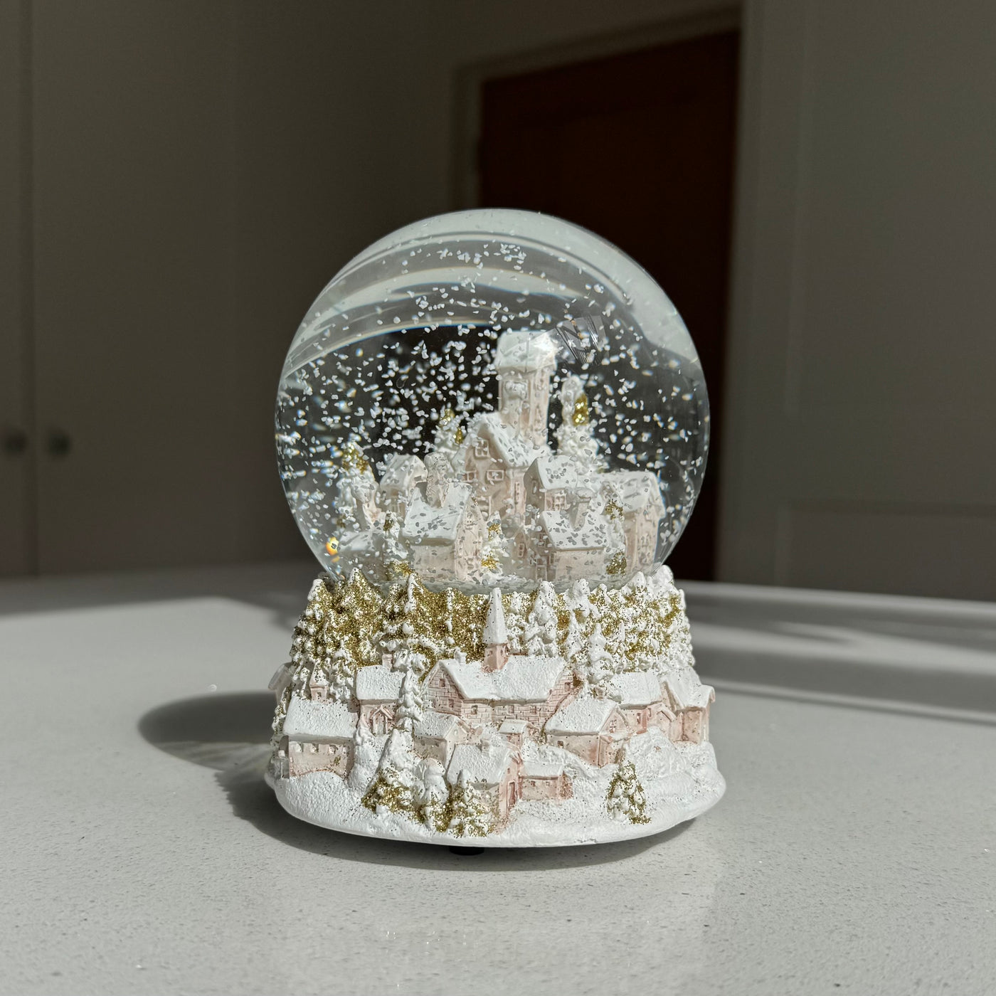 Musical Pink & Glittered Gold Townscape Snow Globe – 14cm
