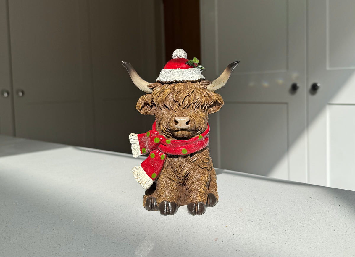 Festive Highland Cow Ornament with Red Scarf and Santa Hat – 17cm