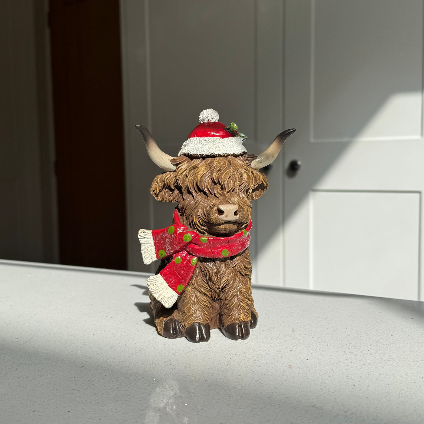 Festive Highland Cow Ornament with Red Scarf and Santa Hat – 17cm