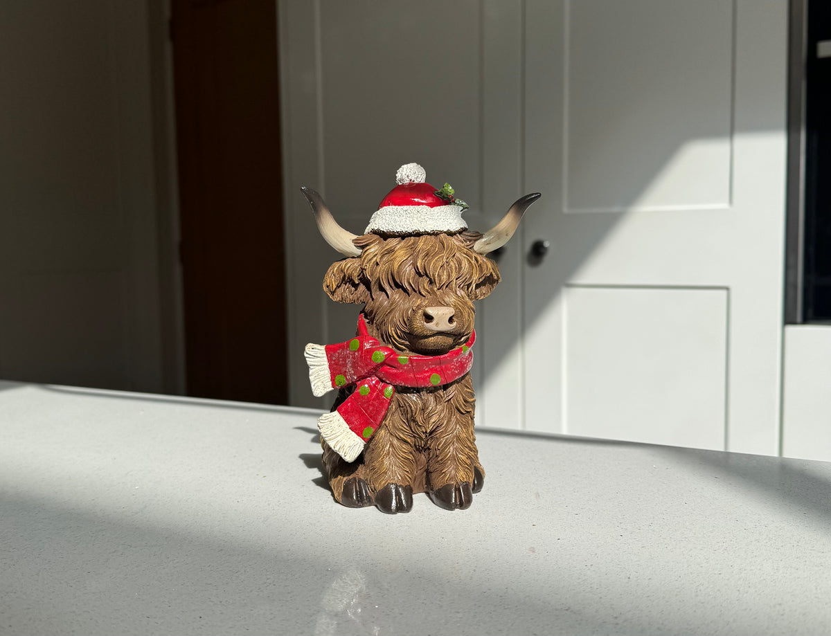 Festive Highland Cow Ornament with Red Scarf and Santa Hat – 17cm