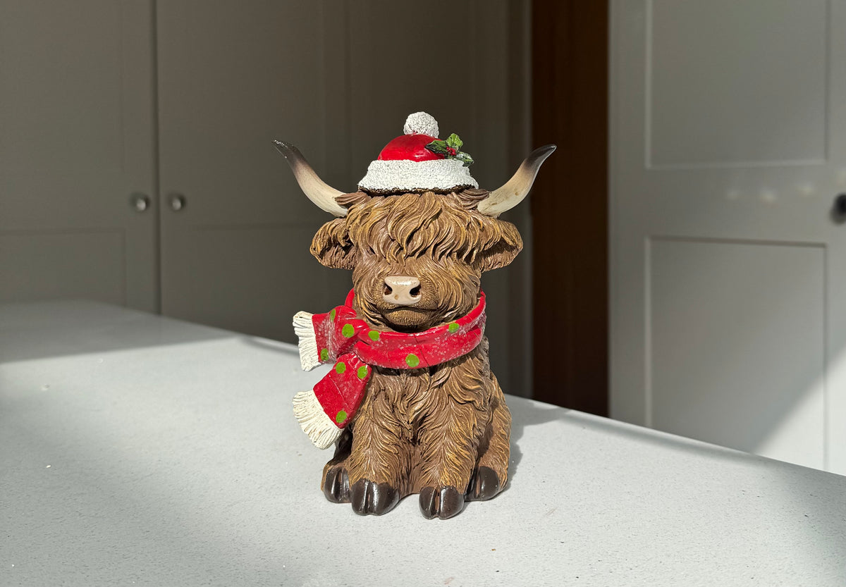 Festive Highland Cow Ornament with Red Scarf and Santa Hat – 17cm