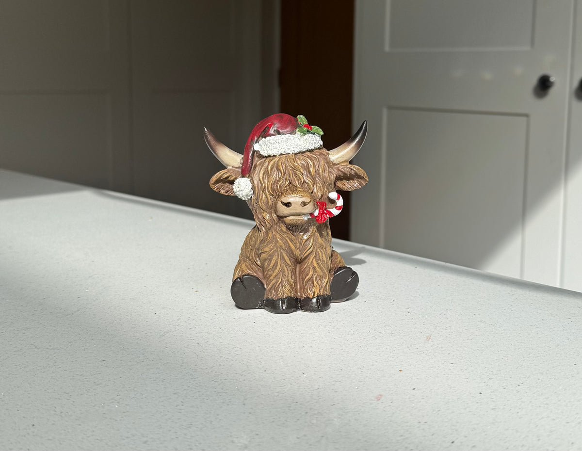 Festive Highland Cow Ornament with Candy Cane – 11cm