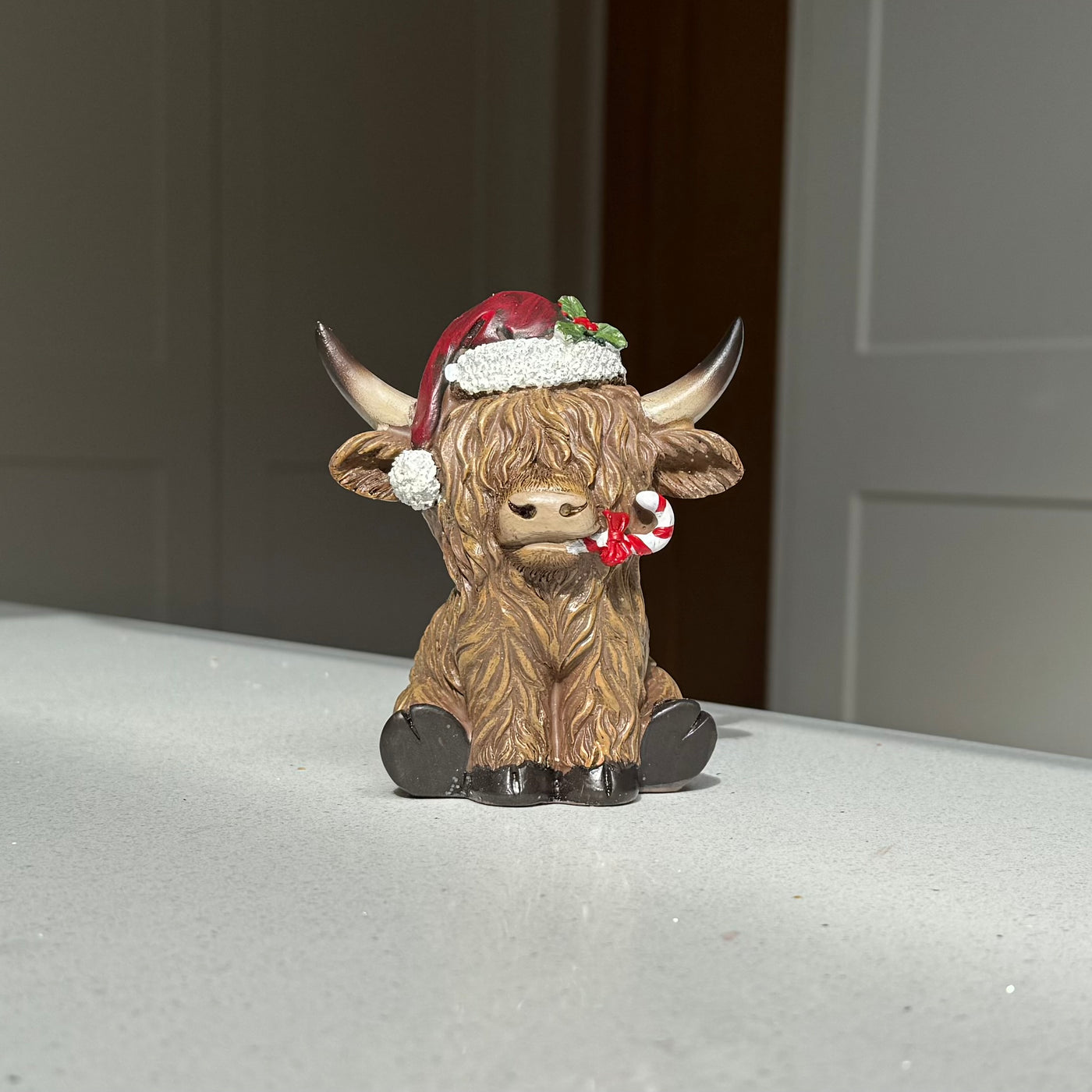 Festive Highland Cow Ornament with Candy Cane – 11cm