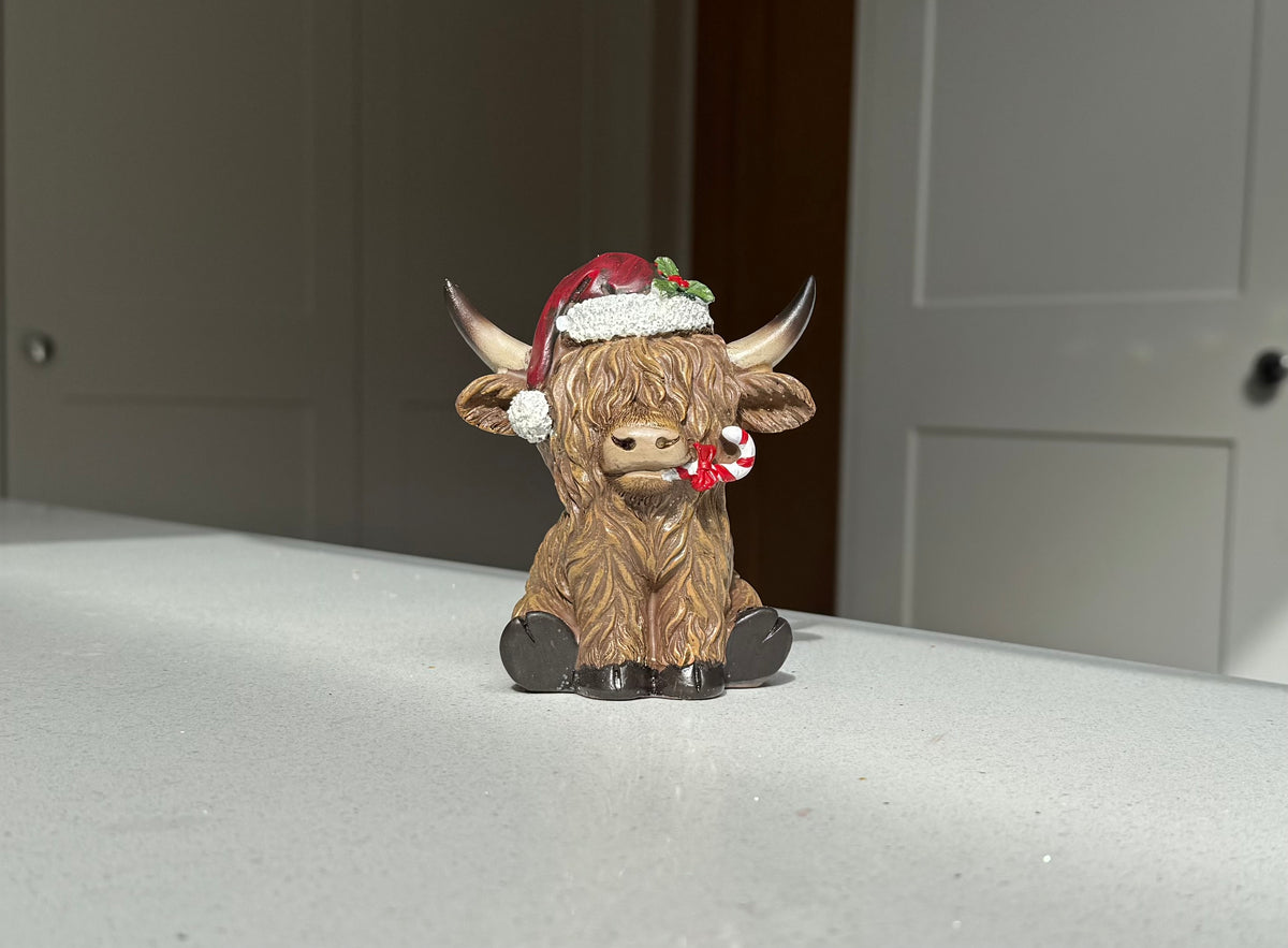 Festive Highland Cow Ornament with Candy Cane – 11cm