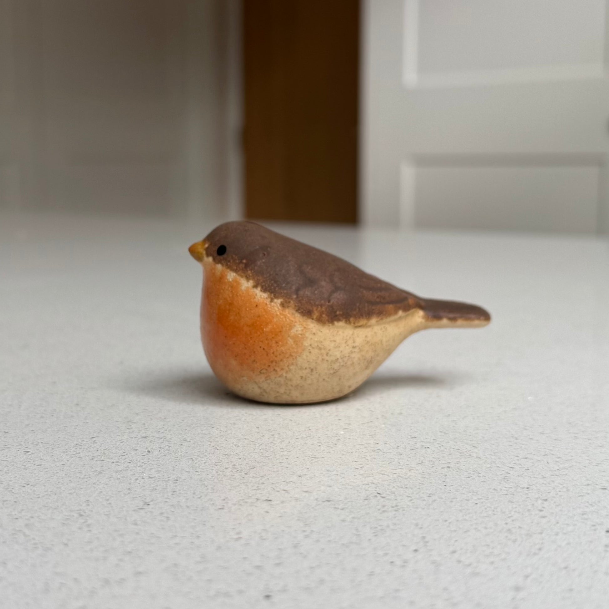 Handmade ceramic robin pair for woodland Christmas styling