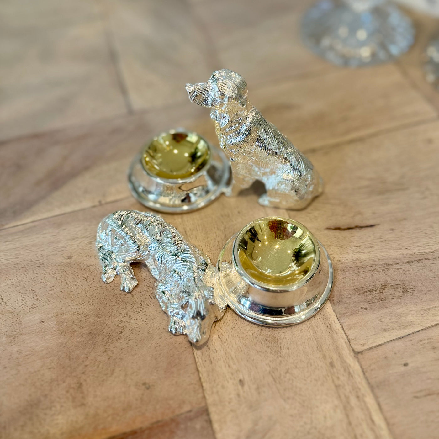Overhead view of the sitting and lying dog salt cruet designs