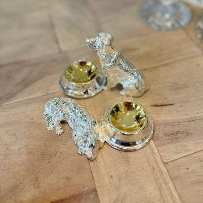 Overhead view of the sitting and lying dog salt cruet designs