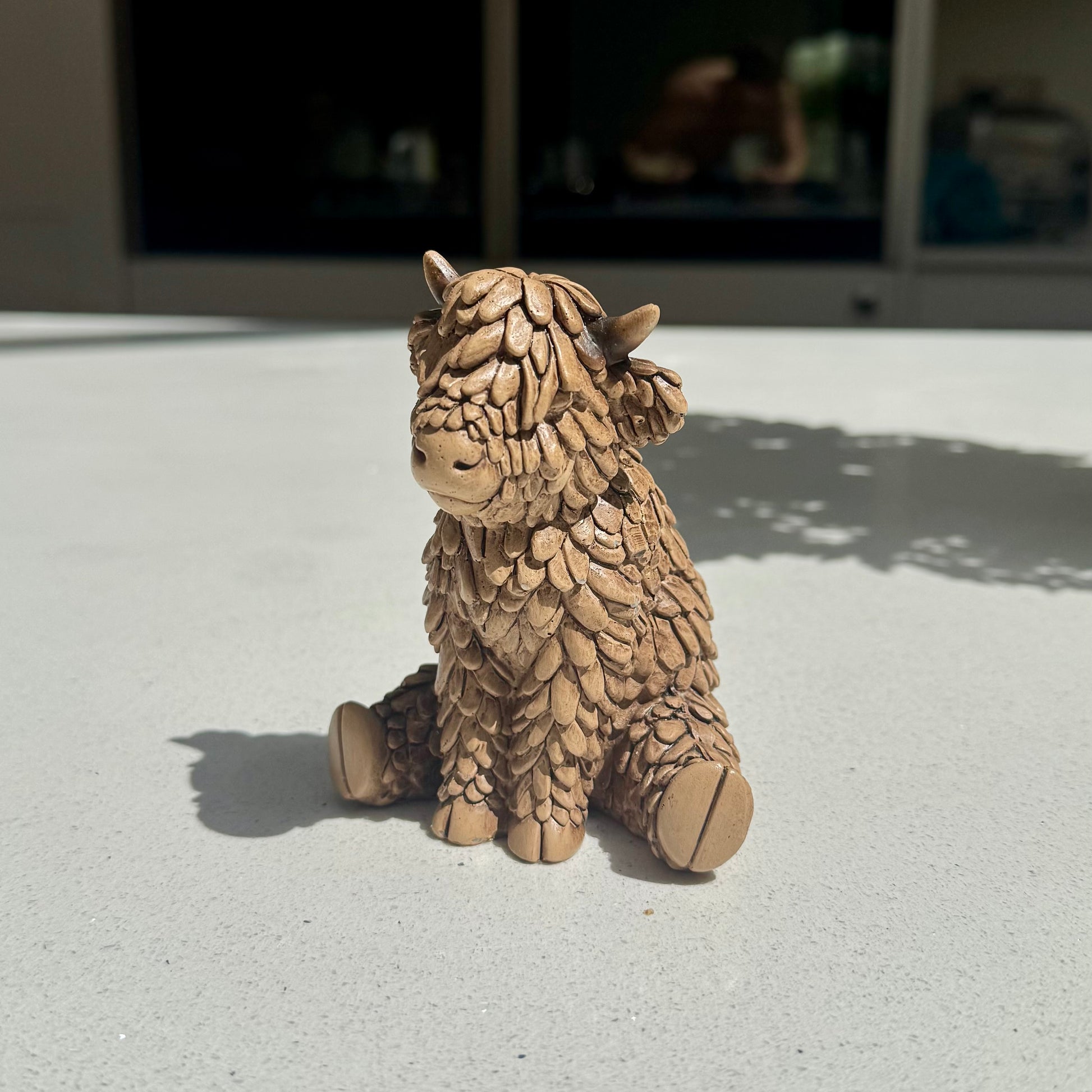 Sitting Highland Cow Ornament