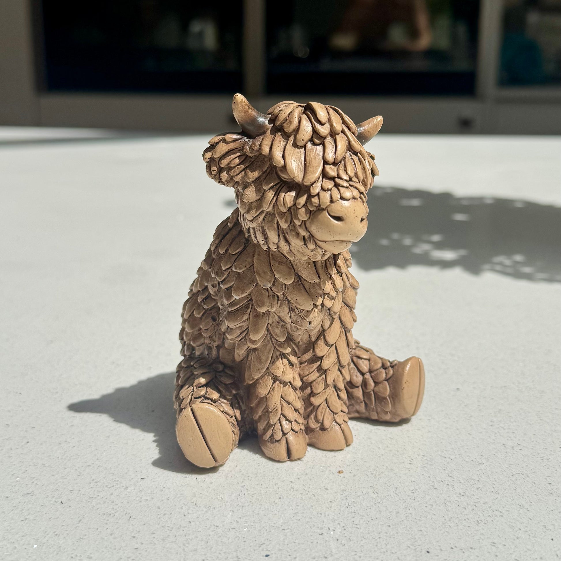 Sitting Highland Cow Ornament