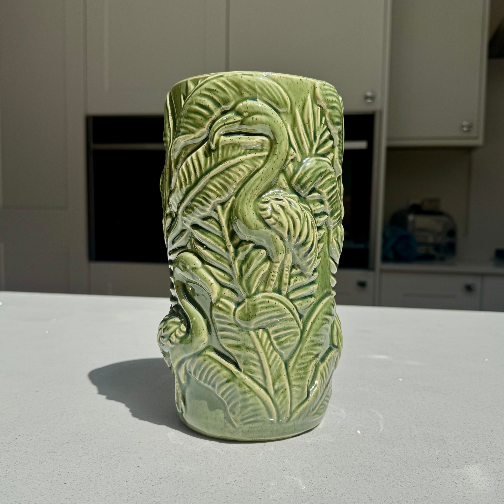 Ceramic flamingo vase with raised botanical foliage
