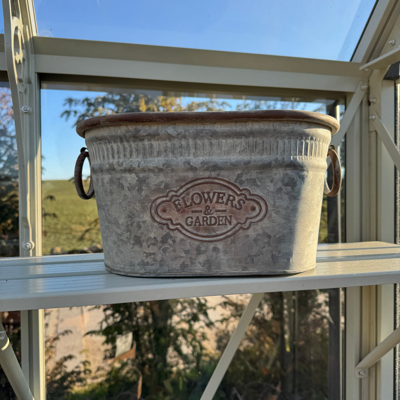 Rustic metal garden planter in galvanised finish