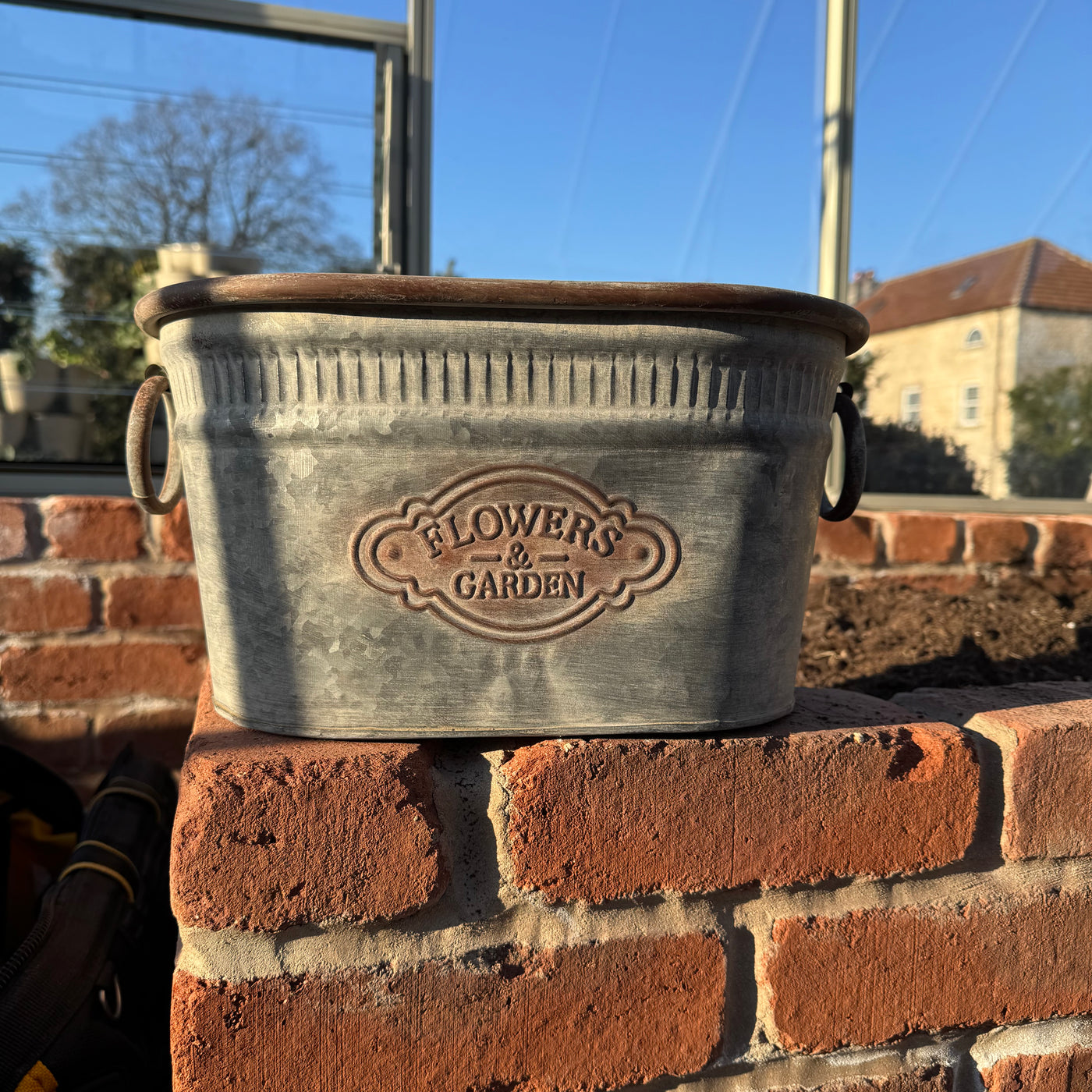 Oblong galvanised metal planter for herbs and flowers