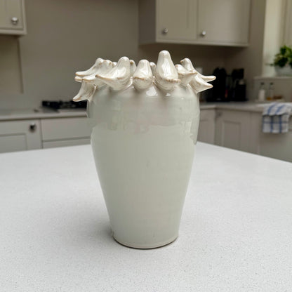 Natural beige ceramic vase with sculpted birds