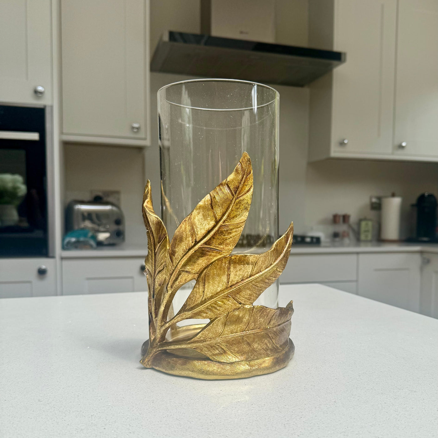 Gold leaf candle holder with clear glass hurricane