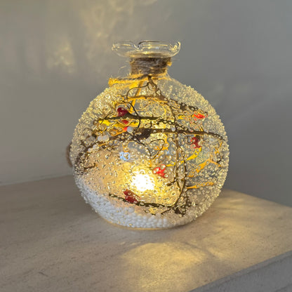 Snowy glass Christmas bauble with winter branch design