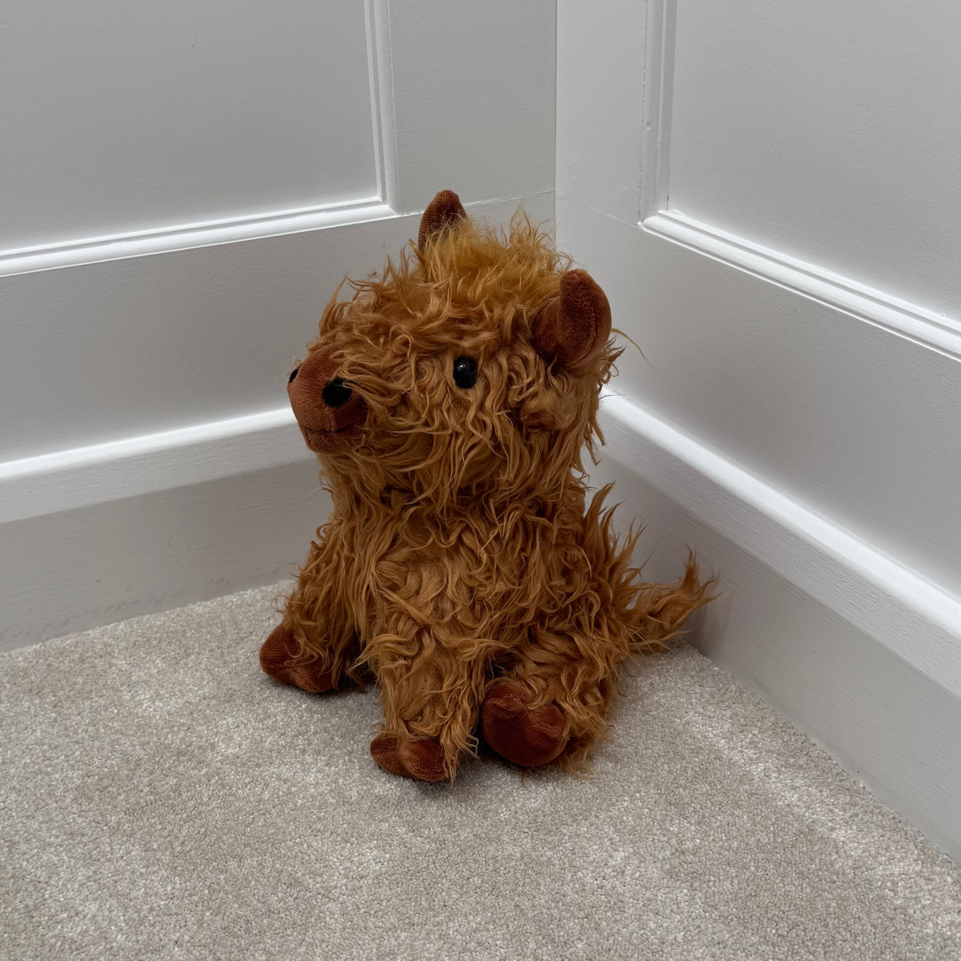 Sitting Highland Cow Doorstop – 23cm