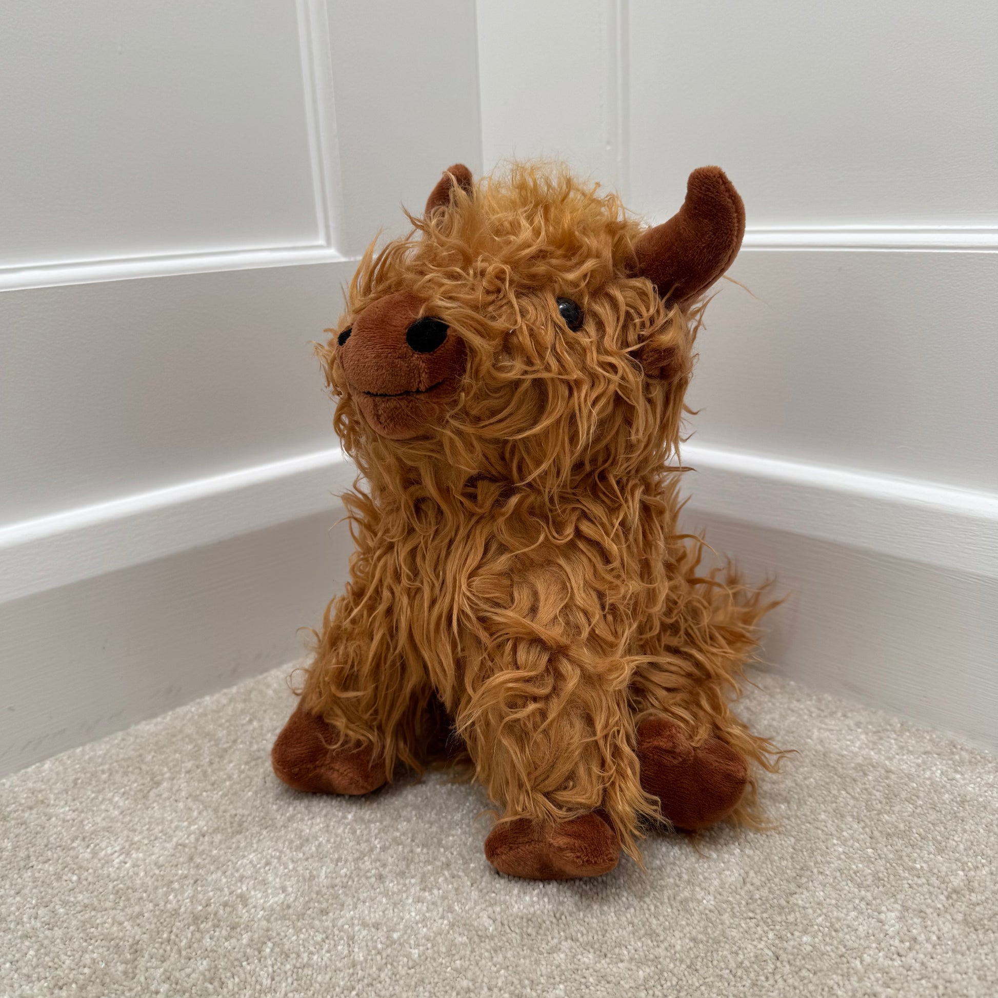 Sitting Highland Cow Doorstop – 23cm