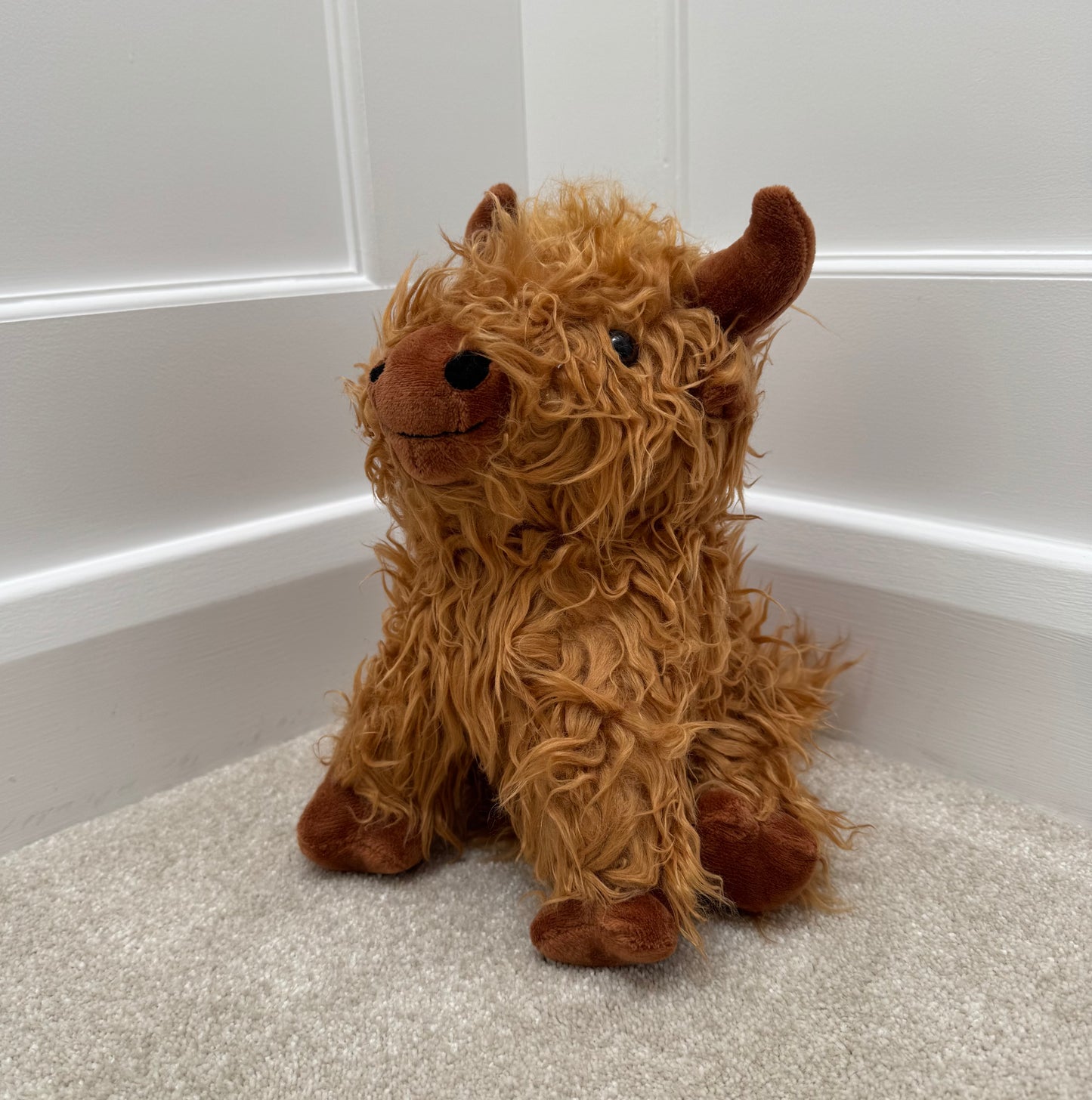 Sitting Highland Cow Doorstop – 23cm