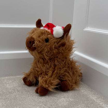 Sitting Highland Cow Doorstop with Santa Hat – 23cm