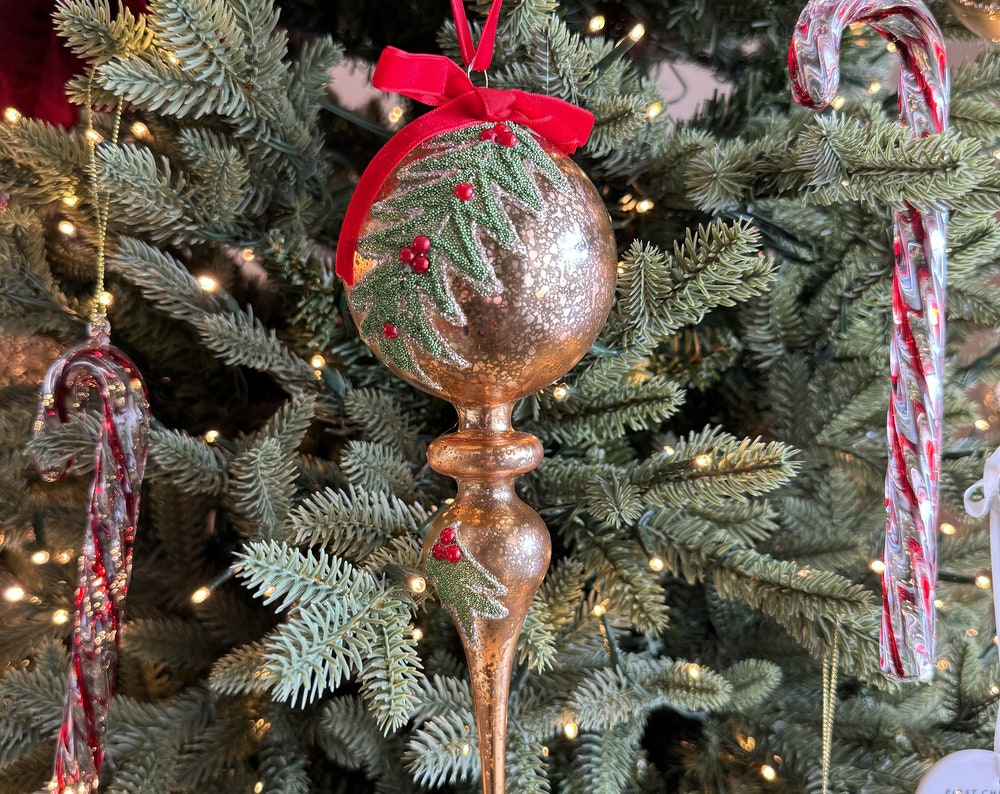 Gold finial Christmas bauble with hand-painted holly leaves and red velvet bow