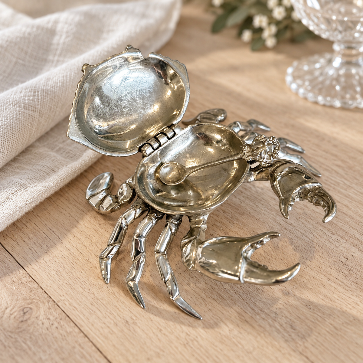 Open pewter crab salt pot showing the empty serving bowl and hinged shell lid