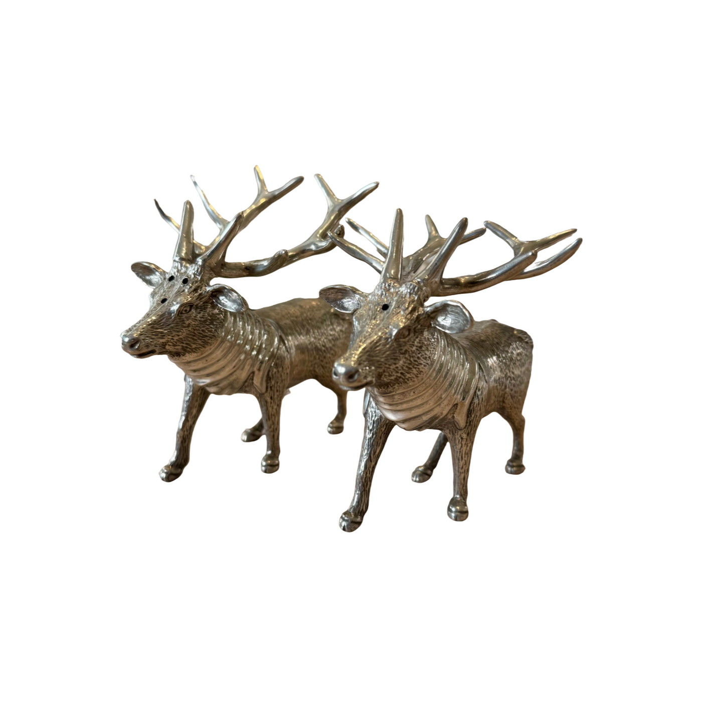 Pair of textured pewter stag salt and pepper shakers against a white background