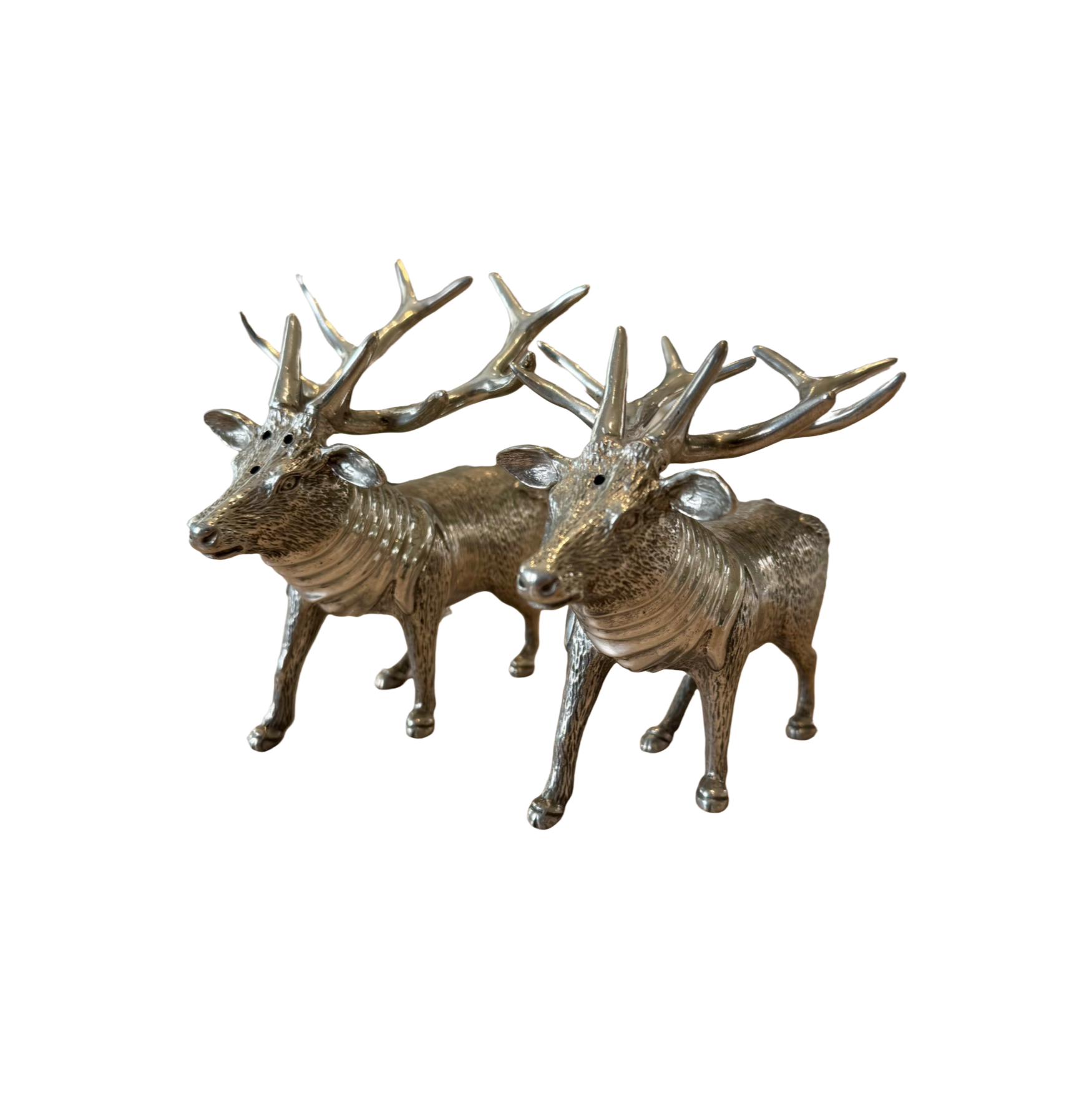 Pair of textured pewter stag salt and pepper shakers against a white background