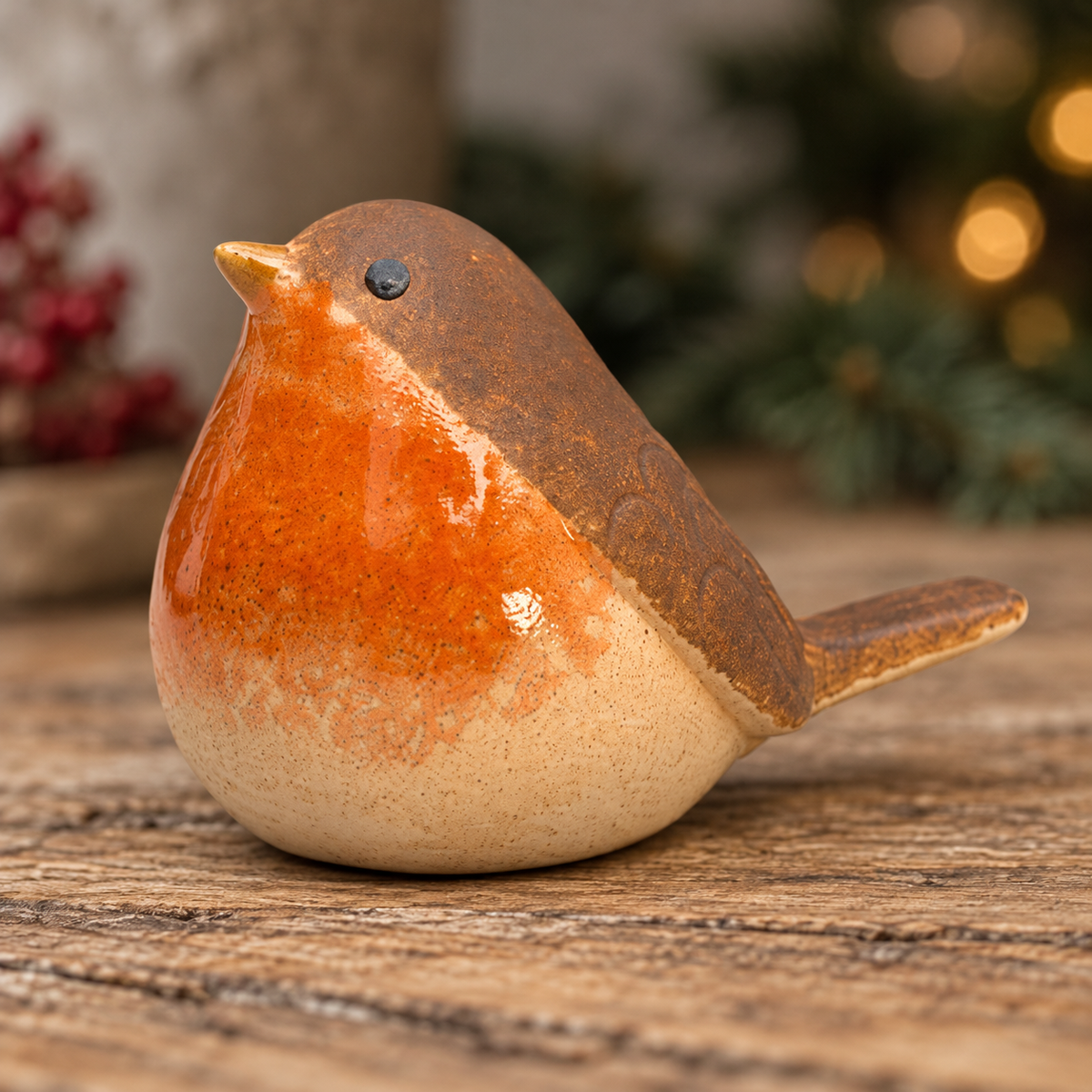 Ceramic robin ornament with a glazed orange breast