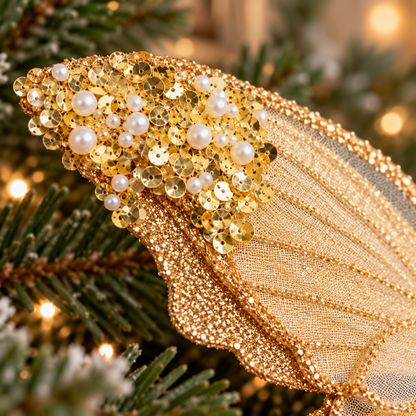 Macro view of gold sequins and pearl-like beads decorating the butterfly's glittered wing tip