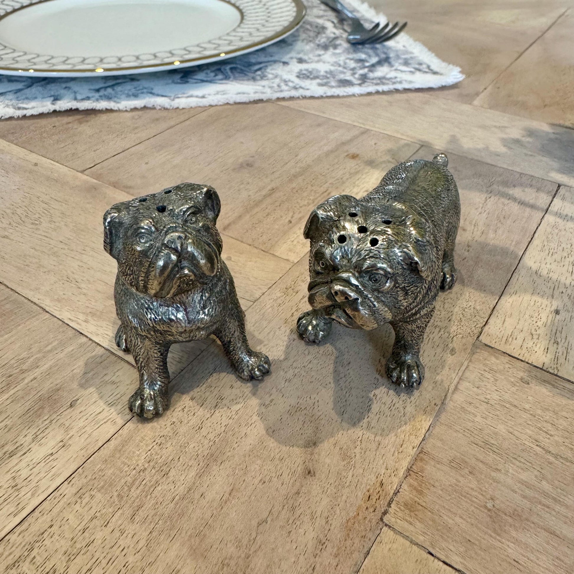 Overhead view of the bulldog shakers showing the dispensing holes and detailed faces
