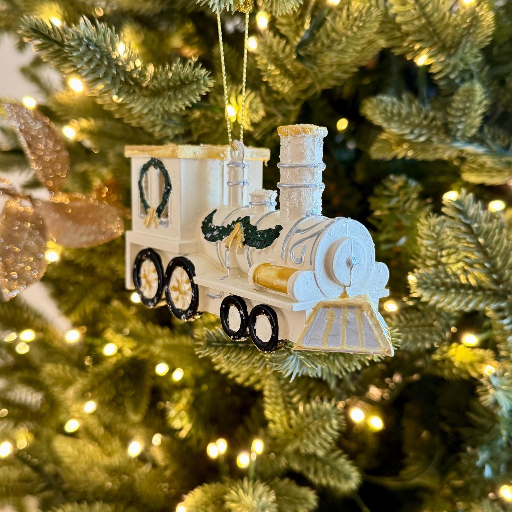 White & Gold Train Bauble – Festive locomotive ornament with green garland detail