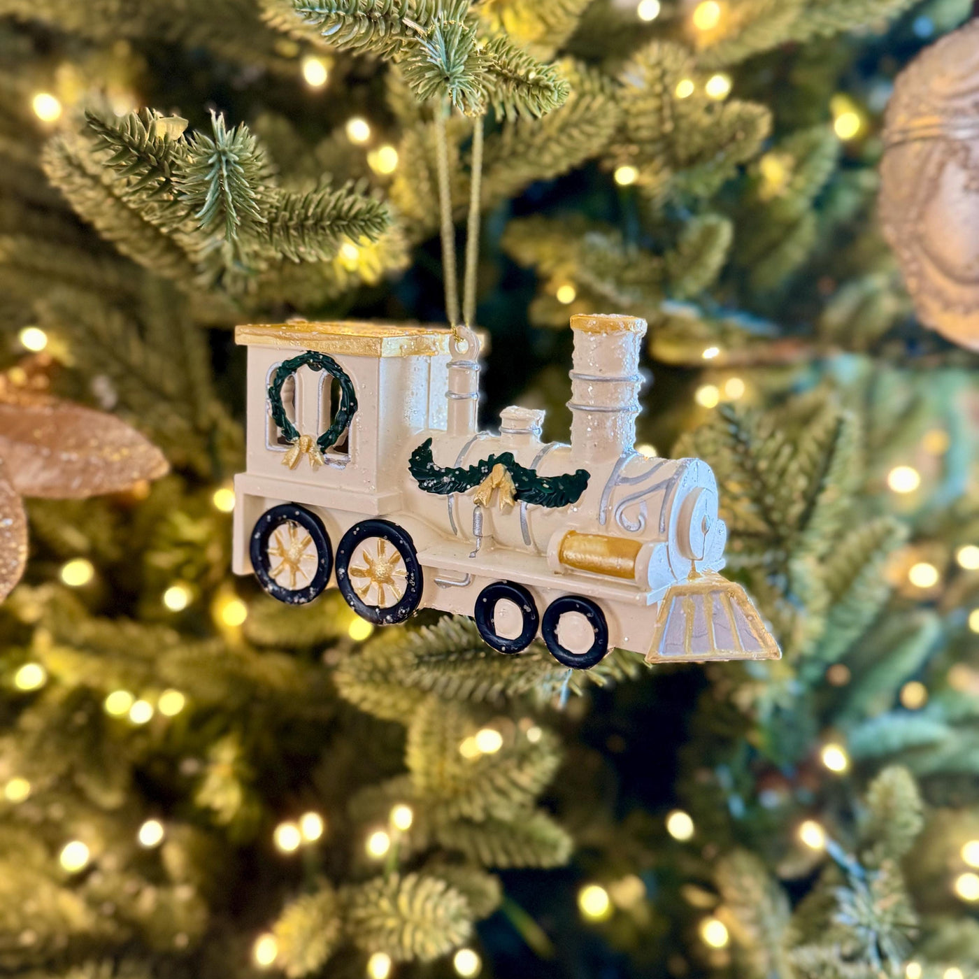 White & Gold Train Bauble – Festive locomotive ornament with green garland detail